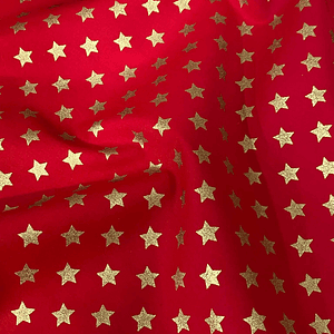 Tecido vermelho com estrelinhas douradas 