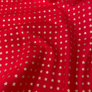 Tecidos vermelho com estrelinhas  douradas pequenas 