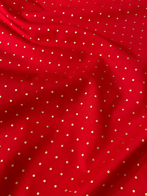 Tecido vermelho com bolinhas douradas