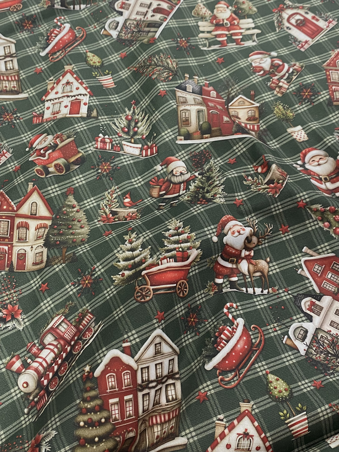 Tecido com trenós e fundo verde  1