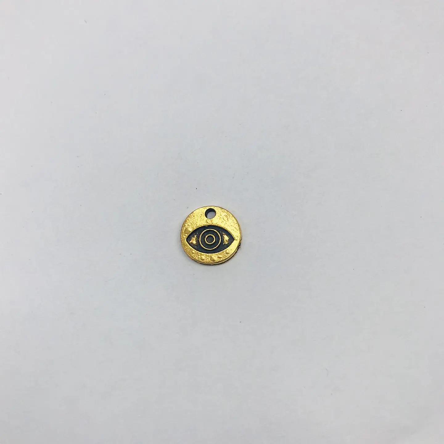 PLACA MONEDA OJO CRUNA40-18 1