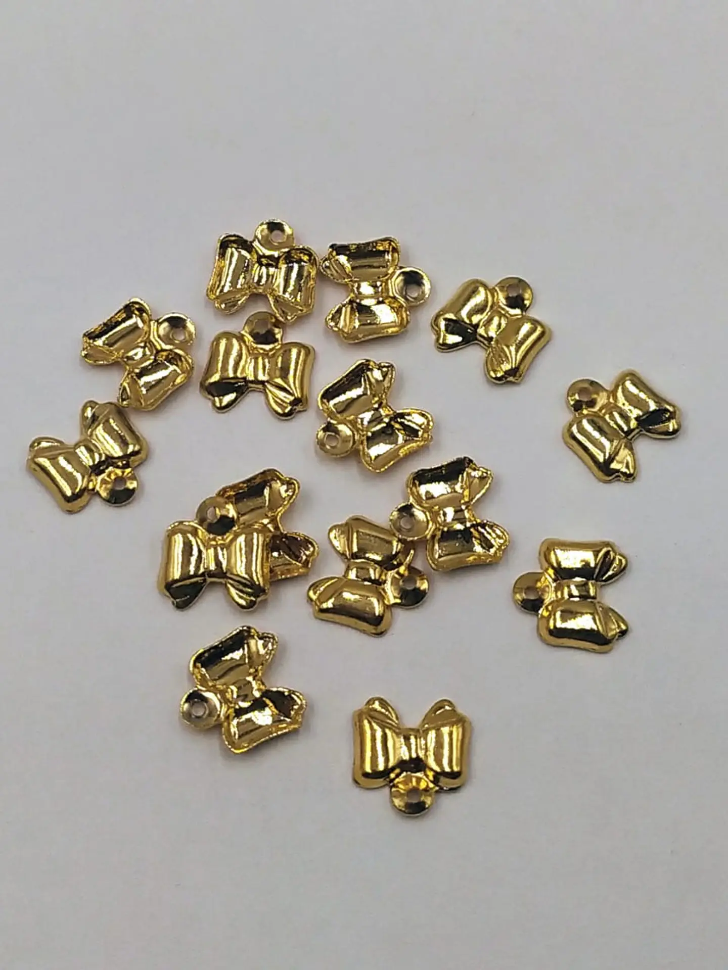 MOÑO GRABADO MINI DIJE BAÑO DE ORO T1299-1                                     1