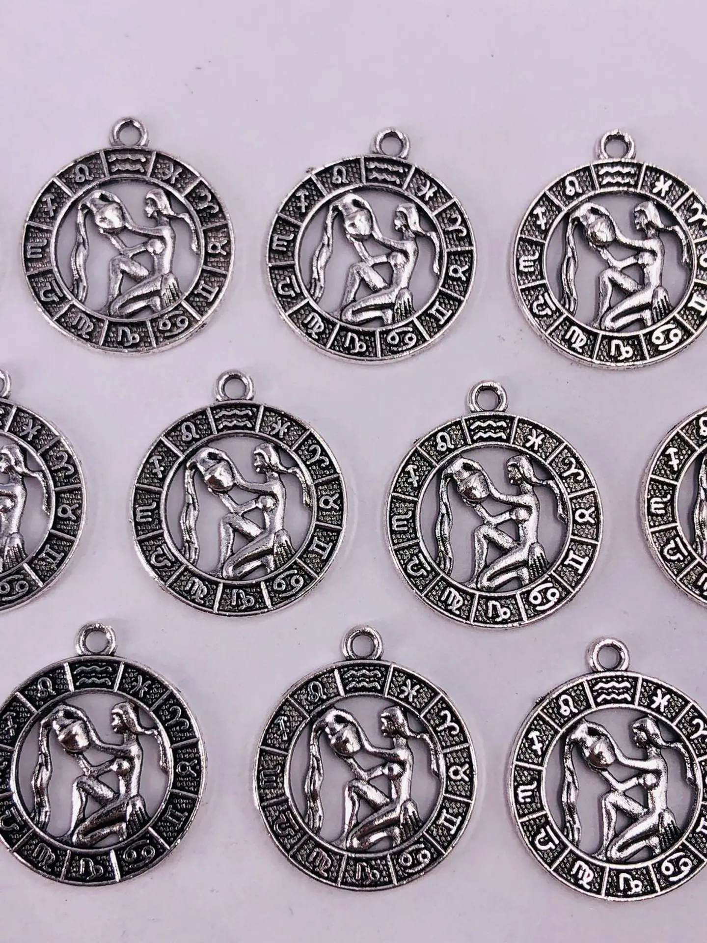 SIGNOS ZODIACALES ZAMAK NIQUEL W-8763 10