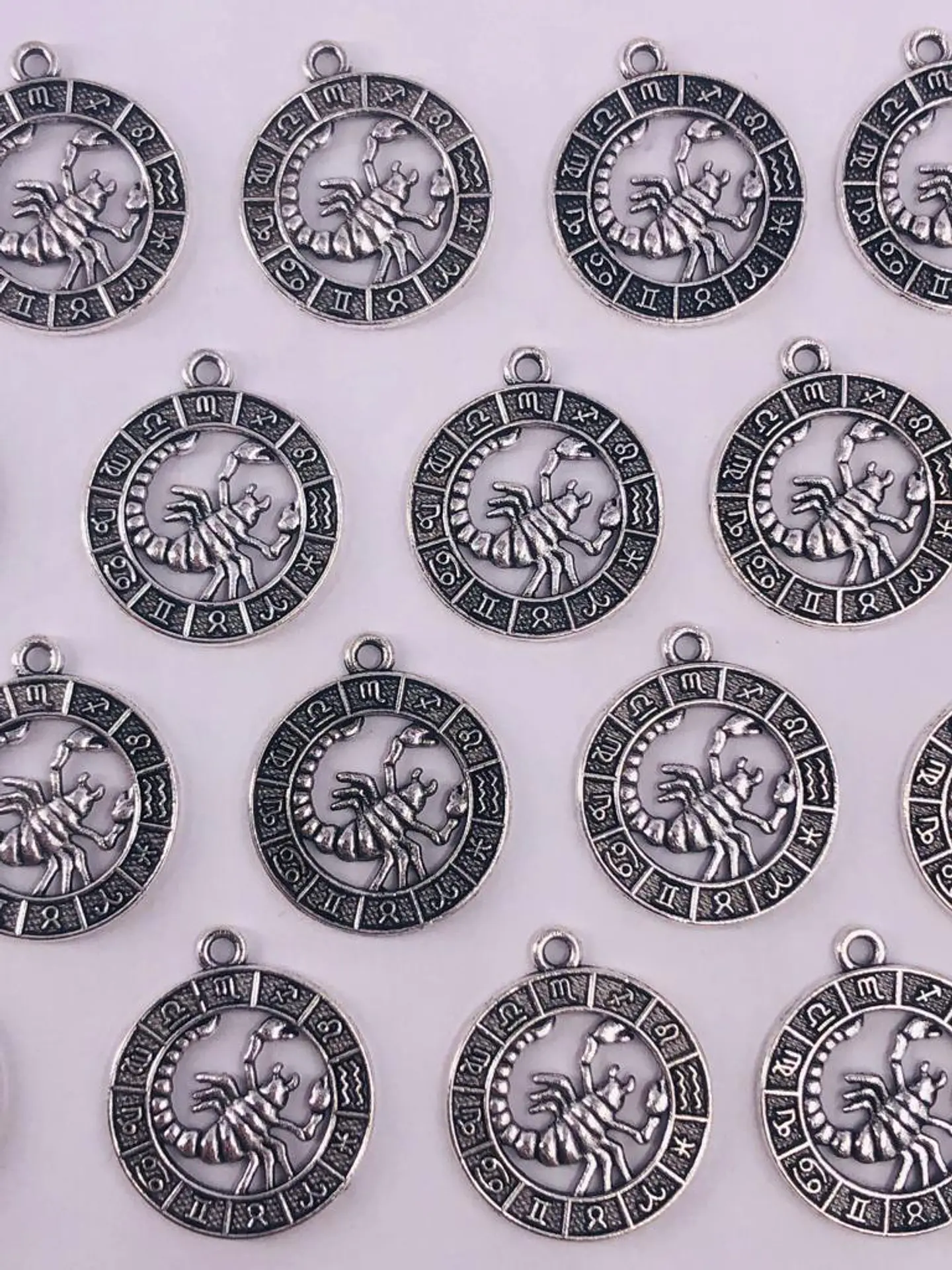 SIGNOS ZODIACALES ZAMAK NIQUEL W-8763 12