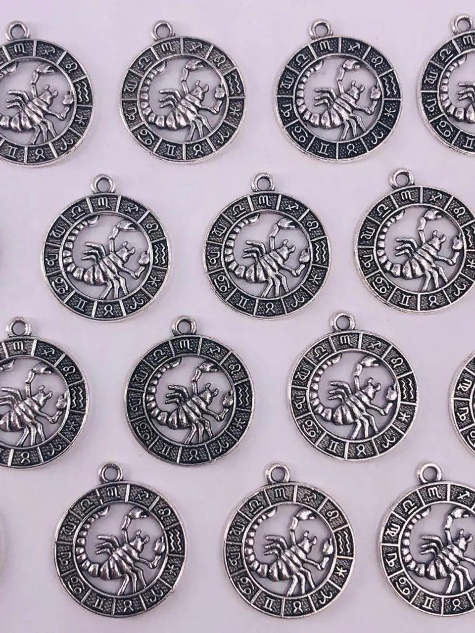 SIGNOS ZODIACALES ZAMAK NIQUEL W-8763 12