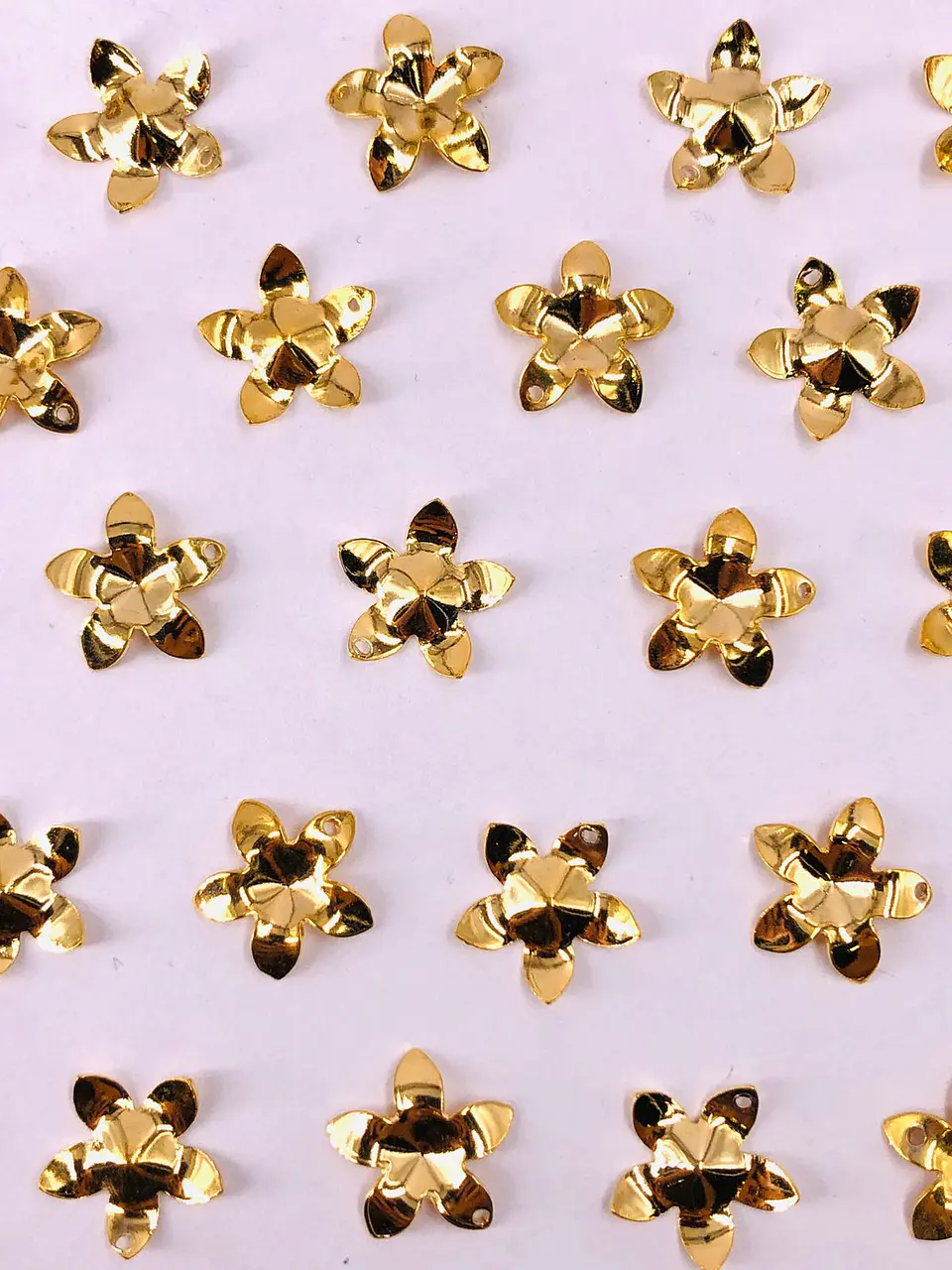 DIJE FLOR BAÑO DE ORO T10264                                1