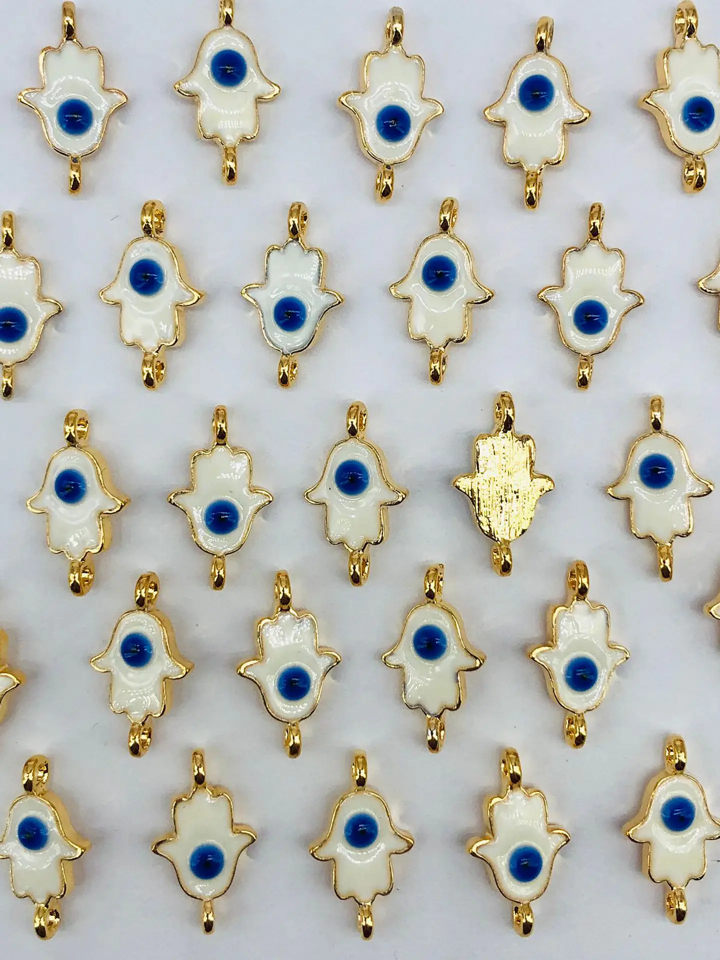 MANO HAMSA OJO BAÑO DE ORO T8027 1
