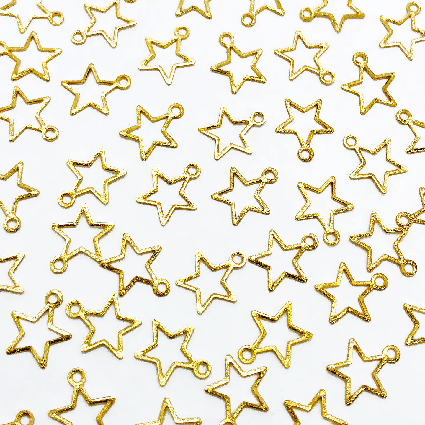 ESTRELLA SILUETA MINI DIJE BAÑO DE ORO T8294 1