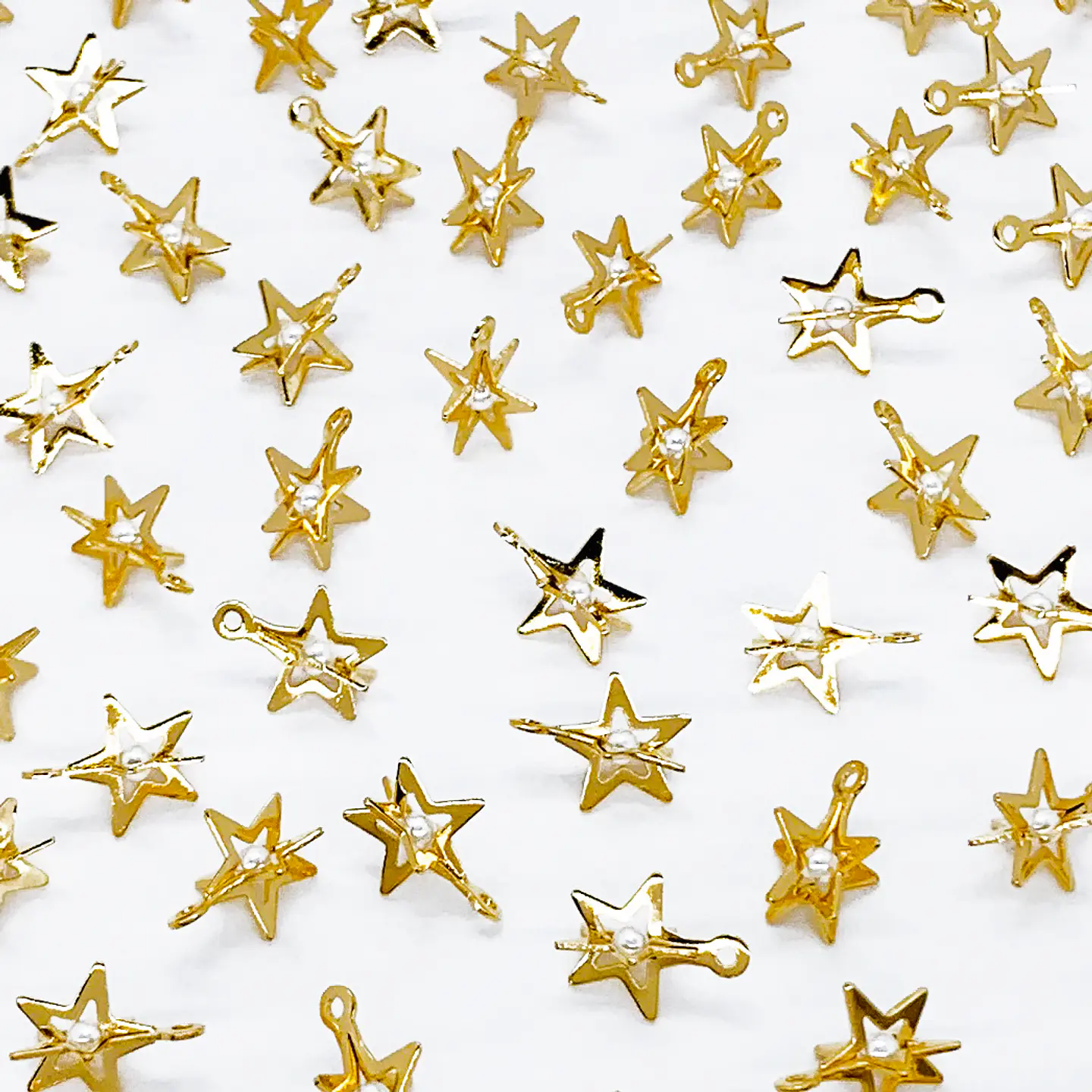 ESTRELLA CON PERLA BAÑO DE ORO T6580 1