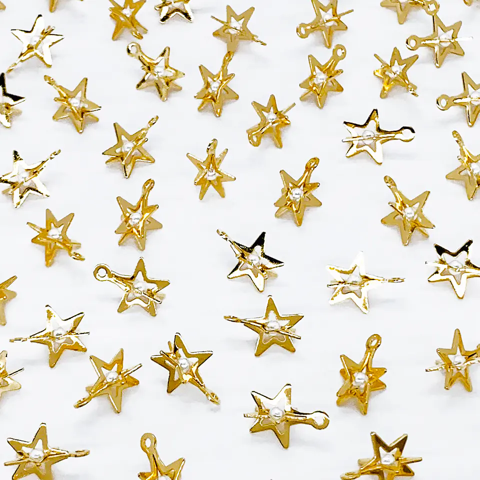 ESTRELLA CON PERLA BAÑO DE ORO T6580 1