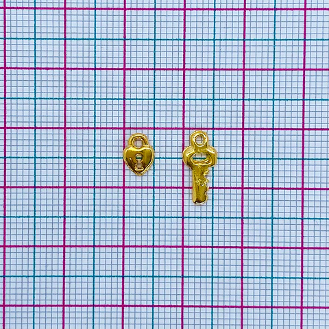 DIJE DUO CORAZON/LLAVE BAÑO DE ORO T1940                         