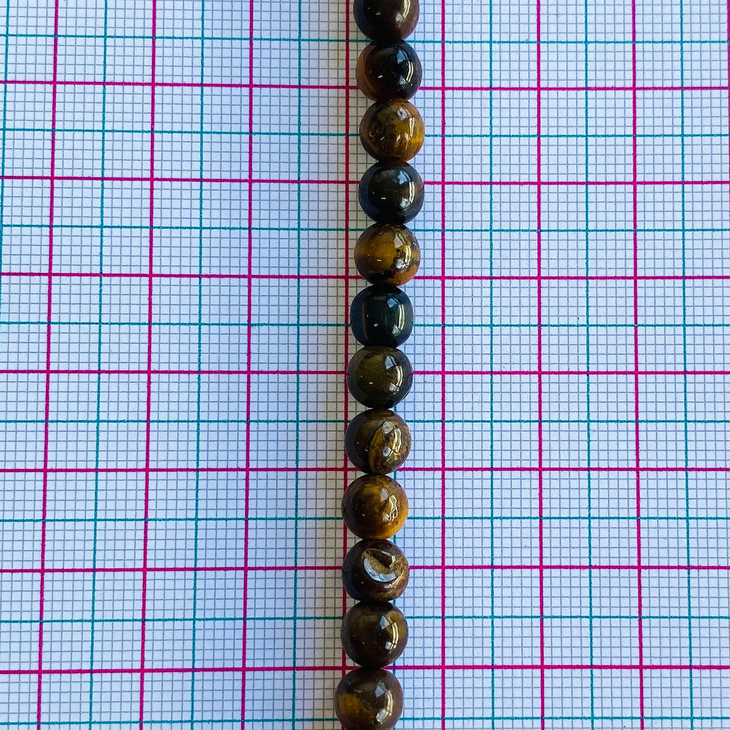 OJO DE TIGRE CAFÉ 6MM 2