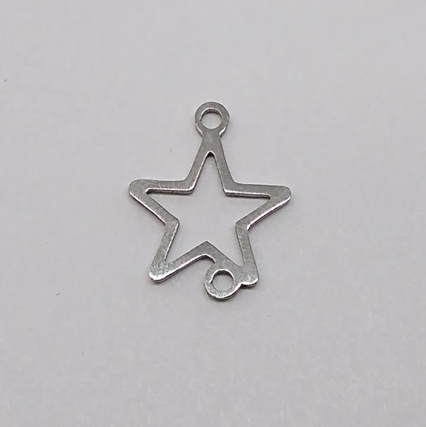 DIJE ✦ ESTRELLA EN ACERO  1