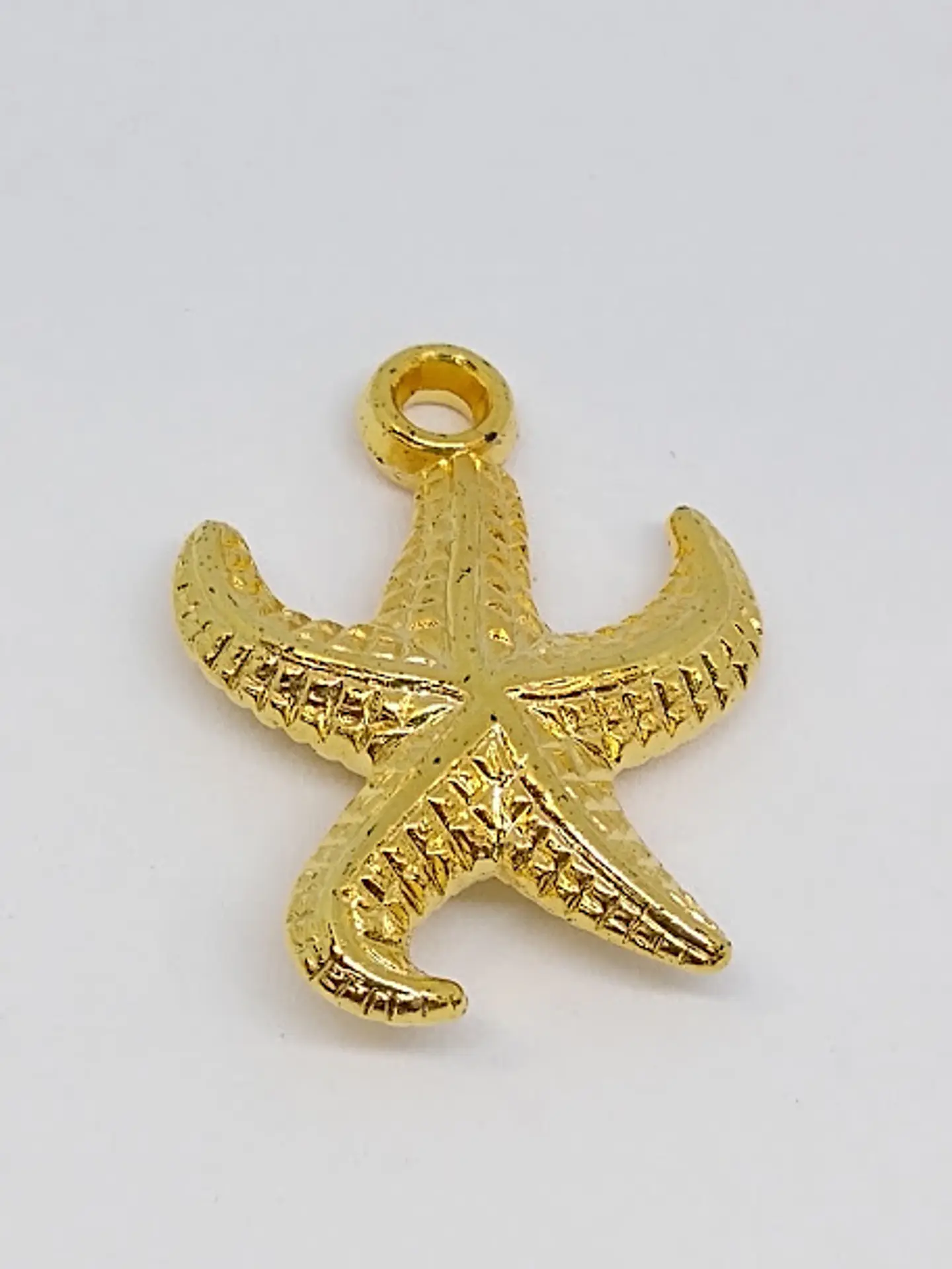 DIJE ESTRELLA BAÑO DE ORO                               1
