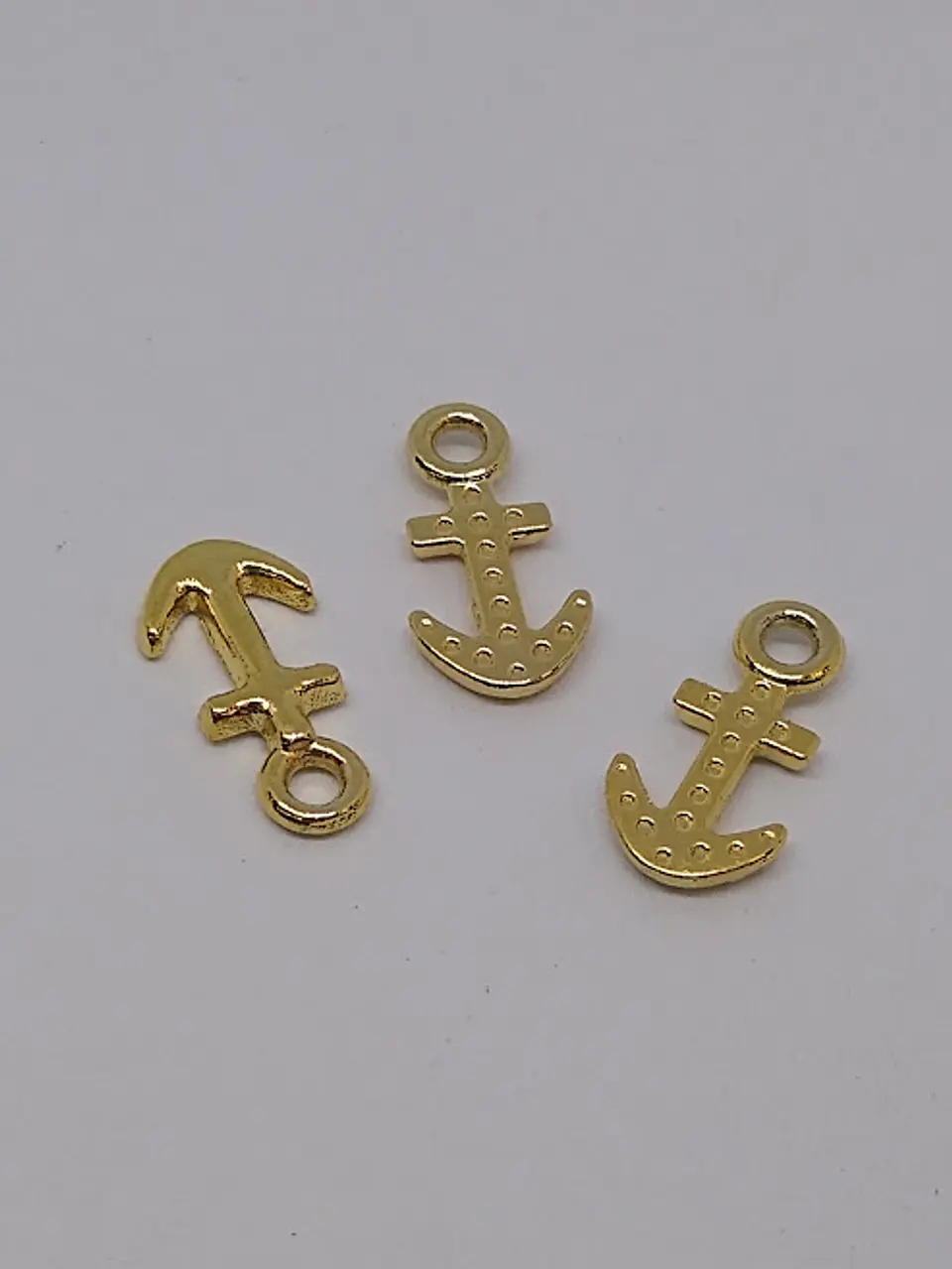 DIJE ANCLA BAÑO DE ORO                                     1