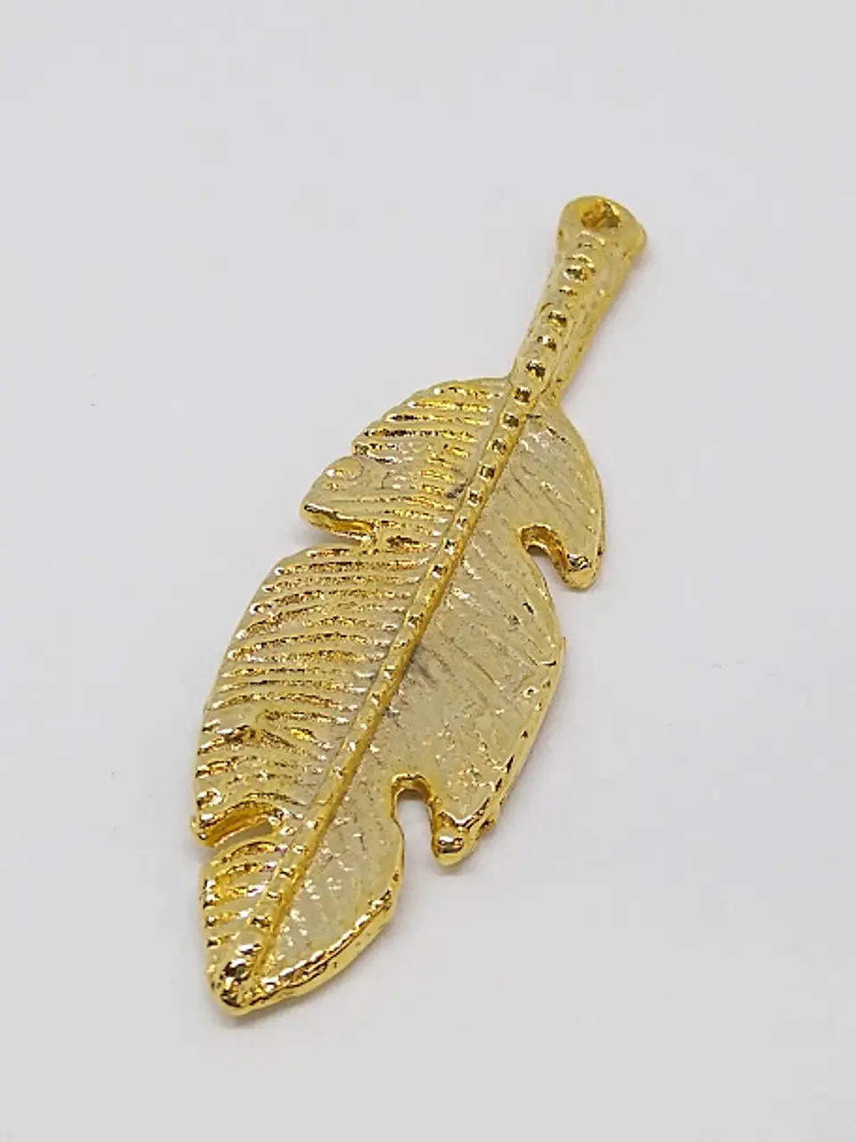 PLUMA BAÑO DE ORO                               1