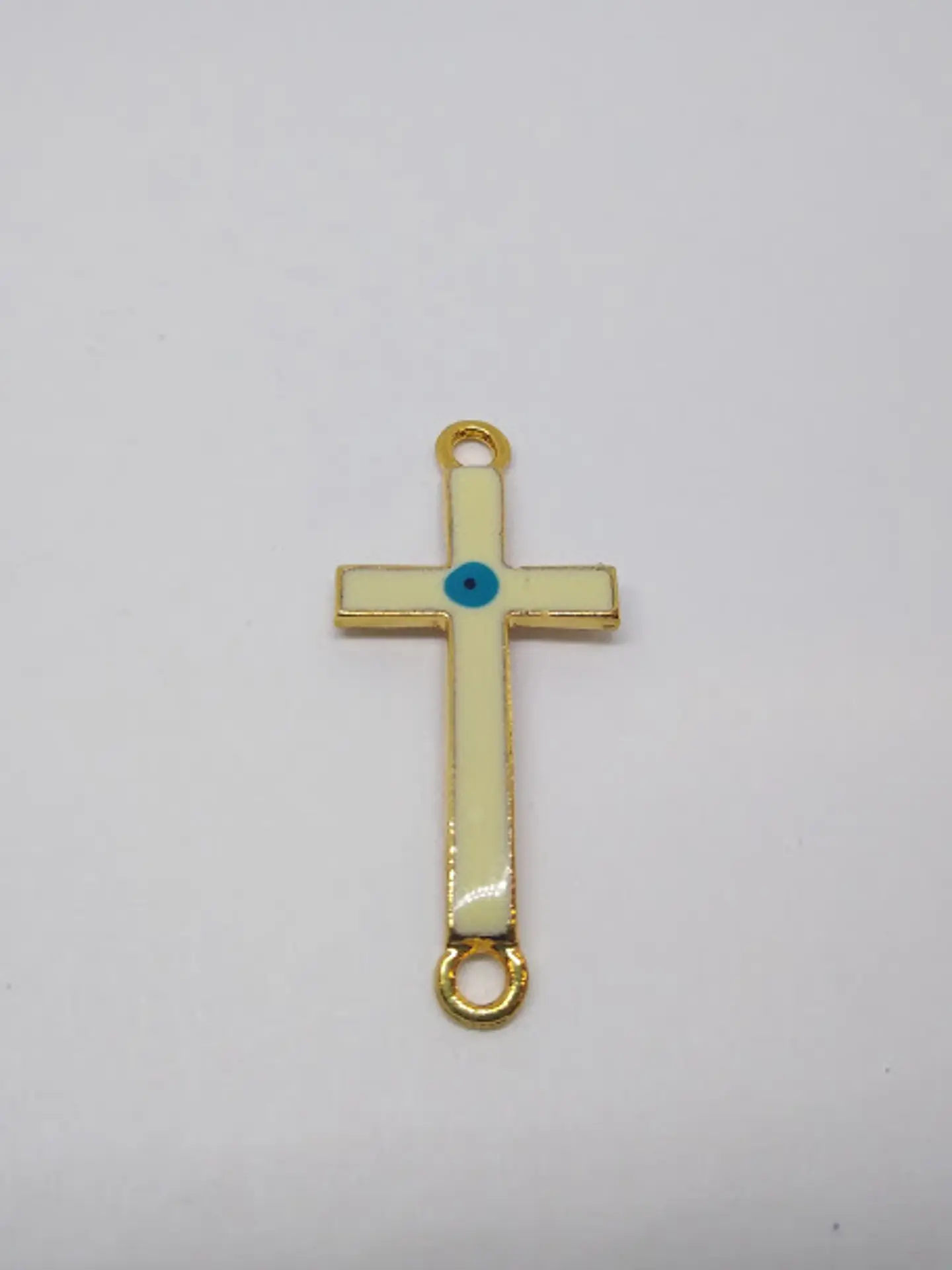 CRUZ OJO BAÑO DE ORO T2864                                     1