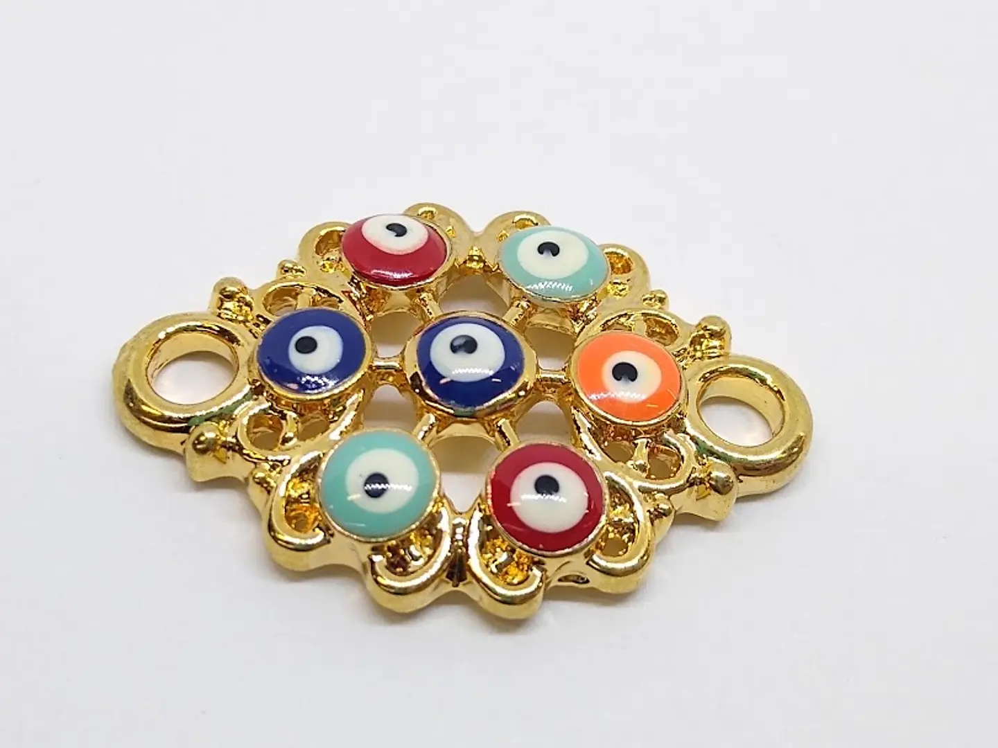 FIGURA OJO TURCO BAÑO DE ORO DN13                                   1