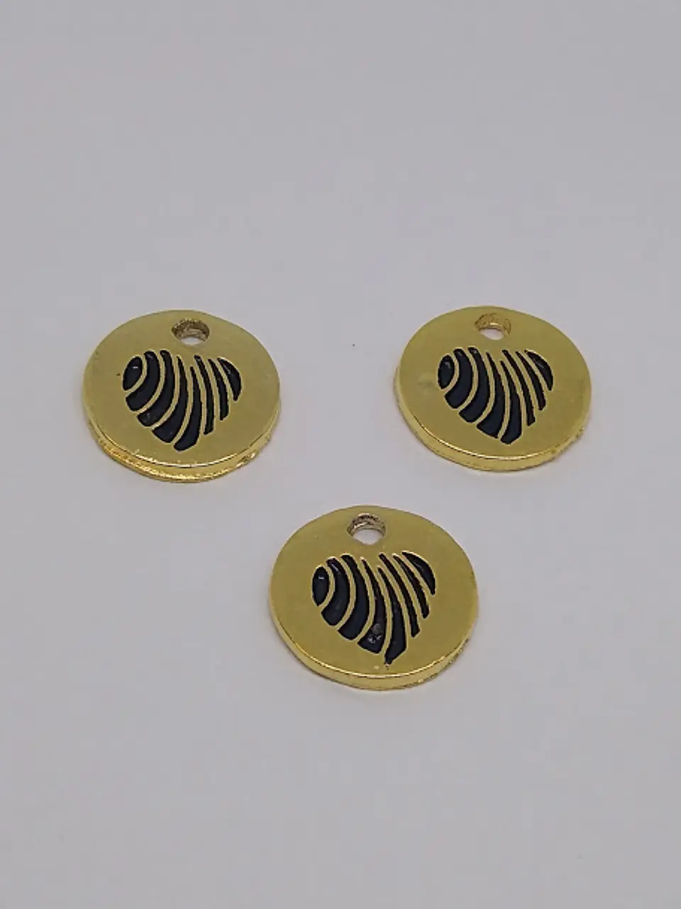 MONEDA CORAZÓN BAÑO DE ORO T5121                1