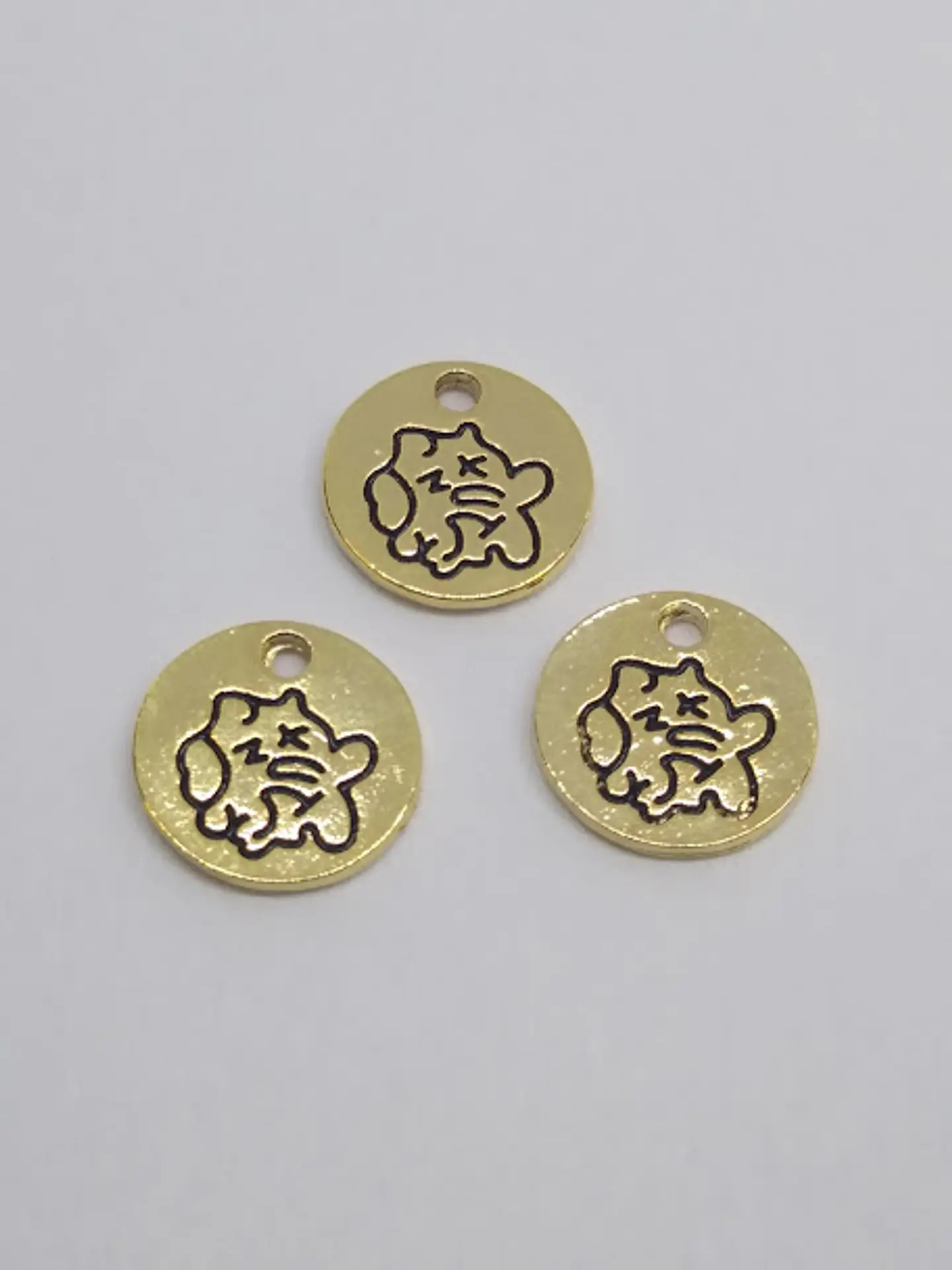 MONEDA PEZ BAÑO DE ORO T5116                   1