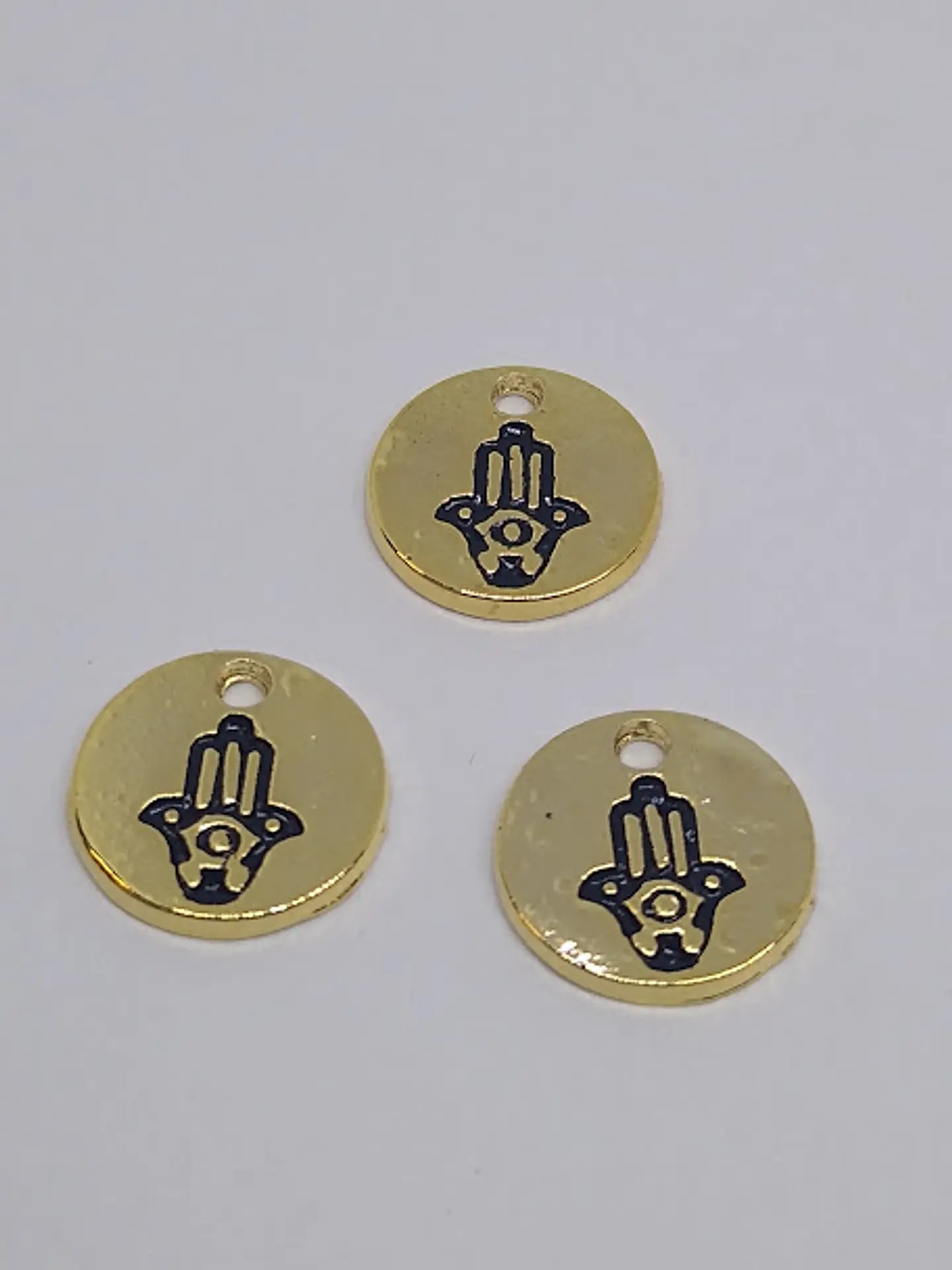 MONEDA MANO HAMSA BAÑO DE ORO T5137                            1