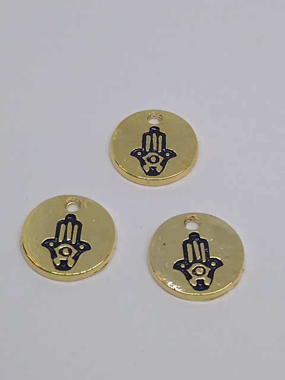 MONEDA MANO HAMSA BAÑO DE ORO T5137                            1