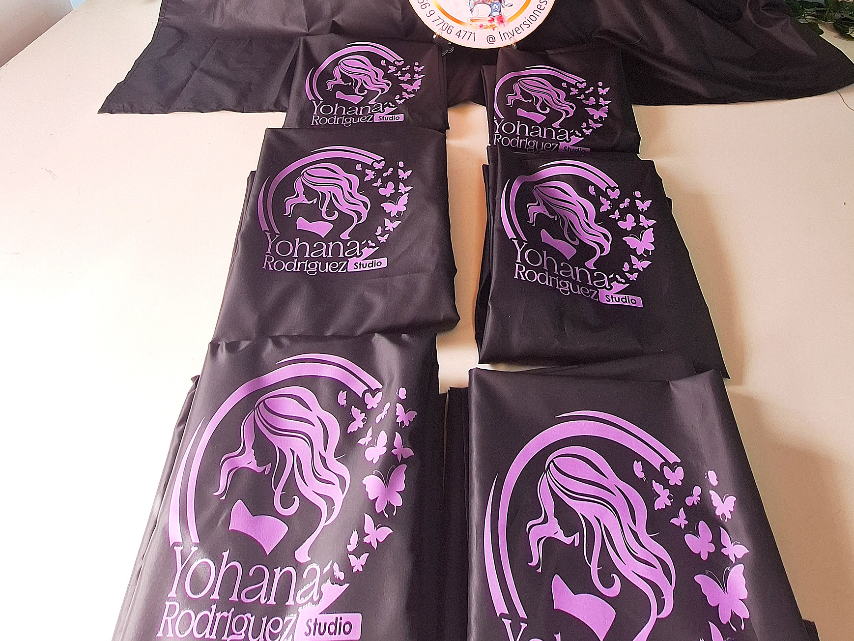 Capas de peluquería antifluidos 12