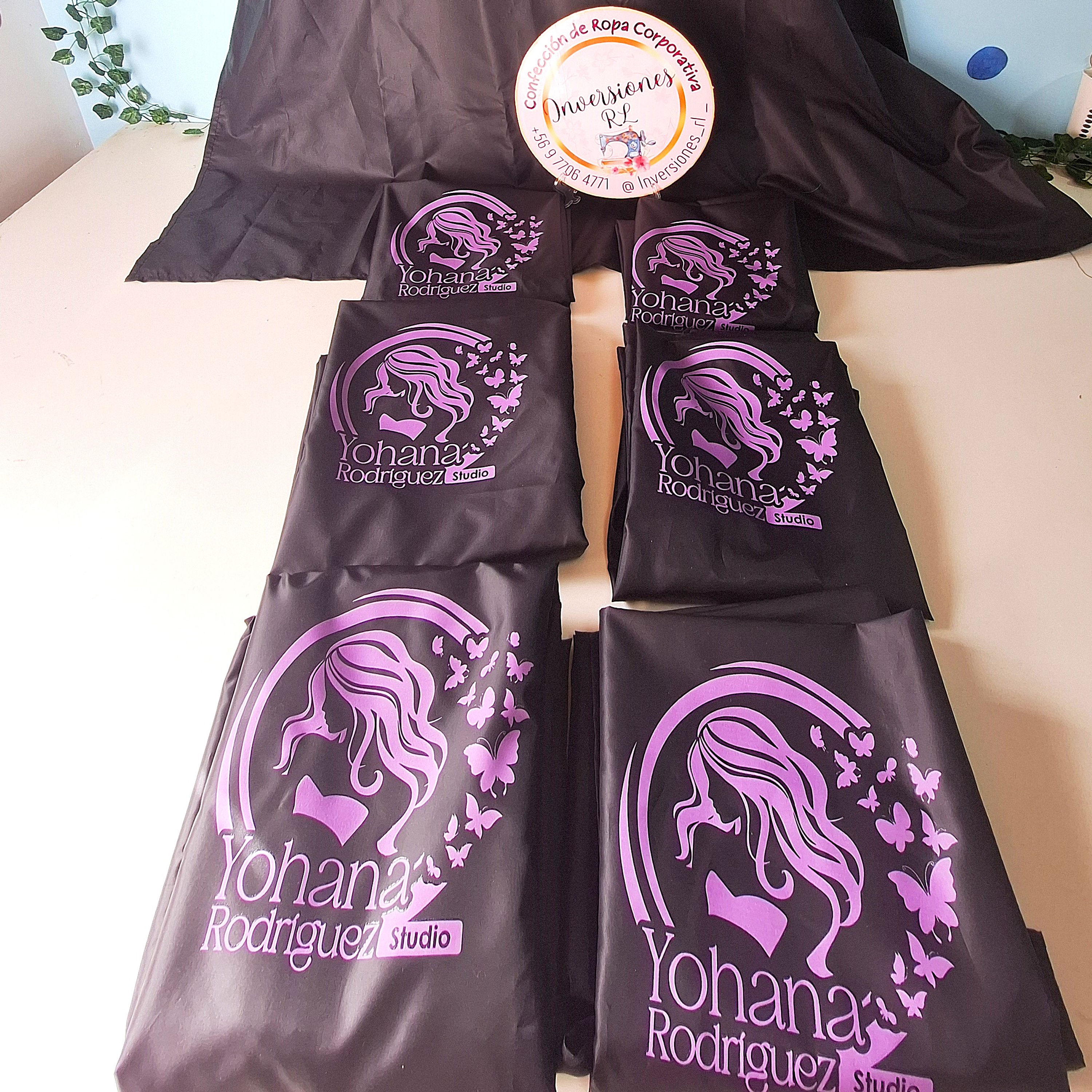 Capas de peluquería antifluidos 12