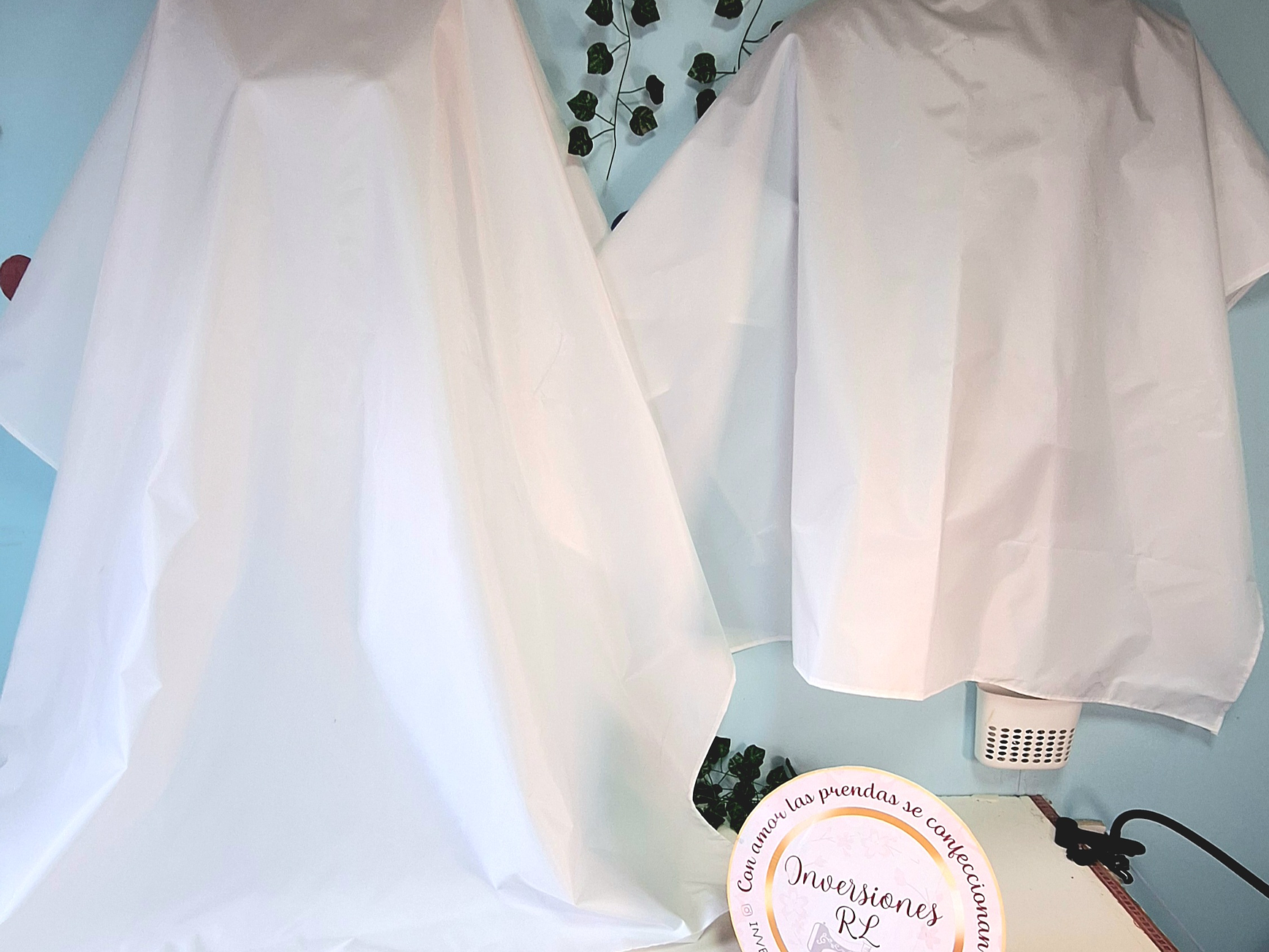 Capas de peluquería antifluidos 18