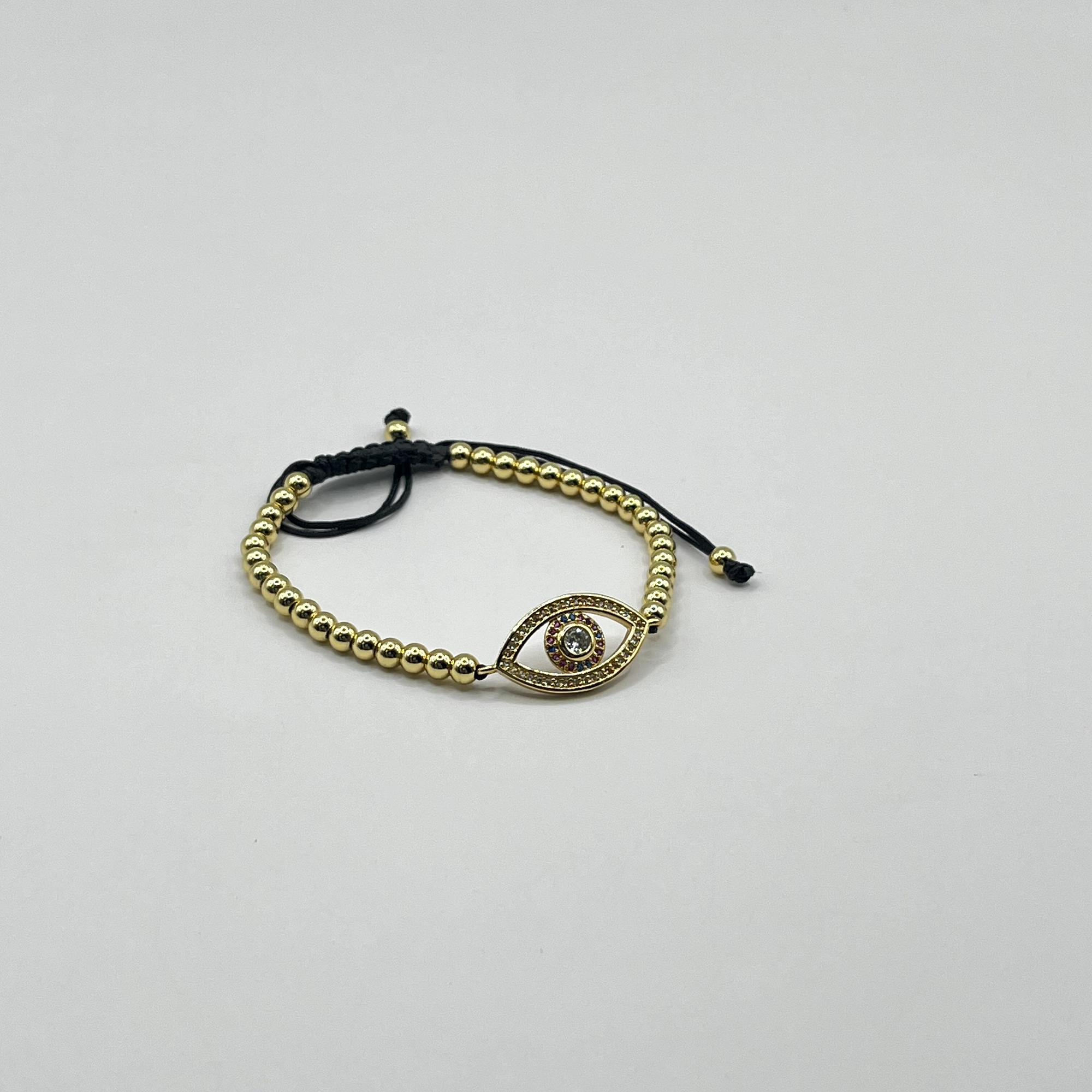 Pulsera de acero quirúrgico dorada con ojo místico ajustable 1