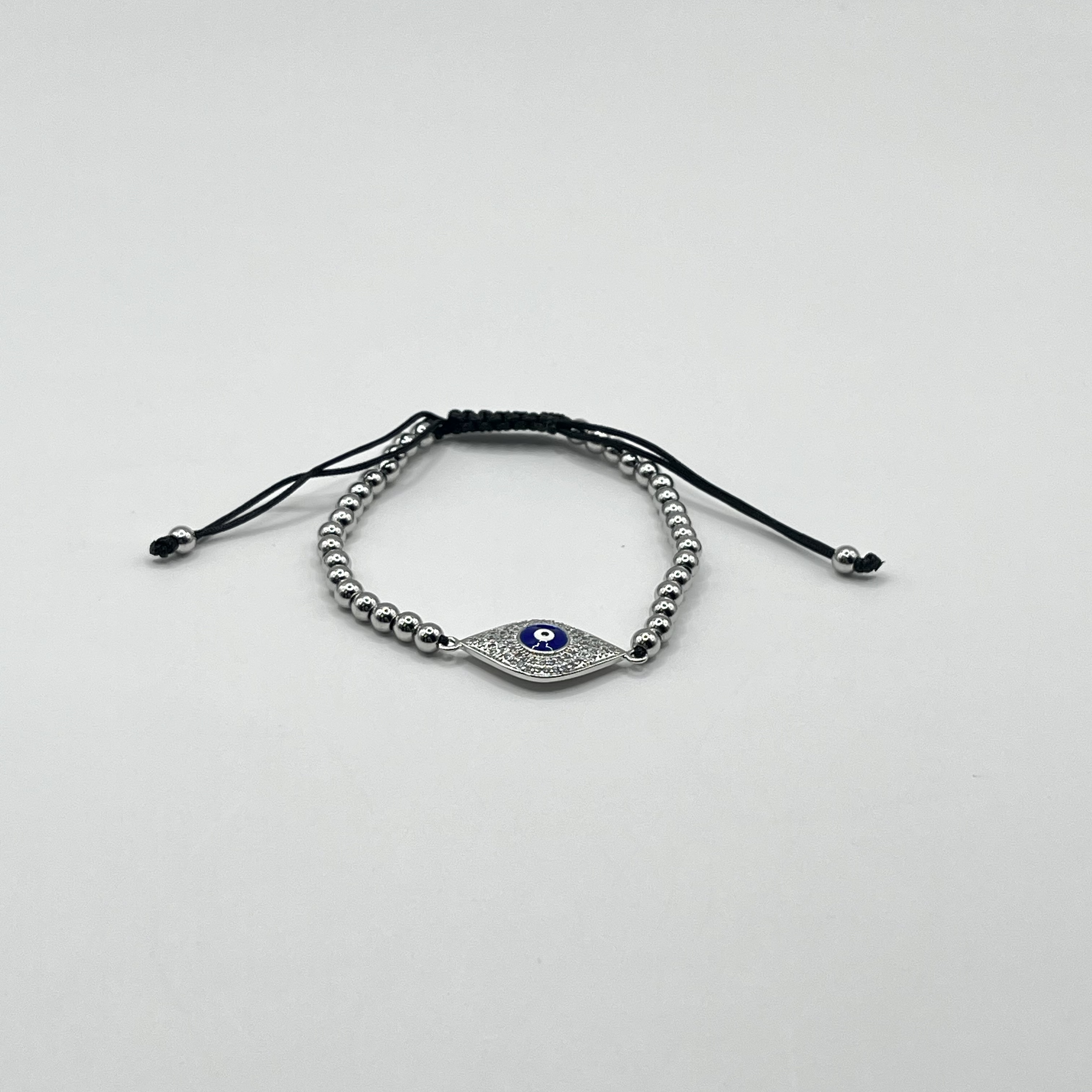 Pulsera de acero quirúrgico plateada con ojo místico ajustable 1