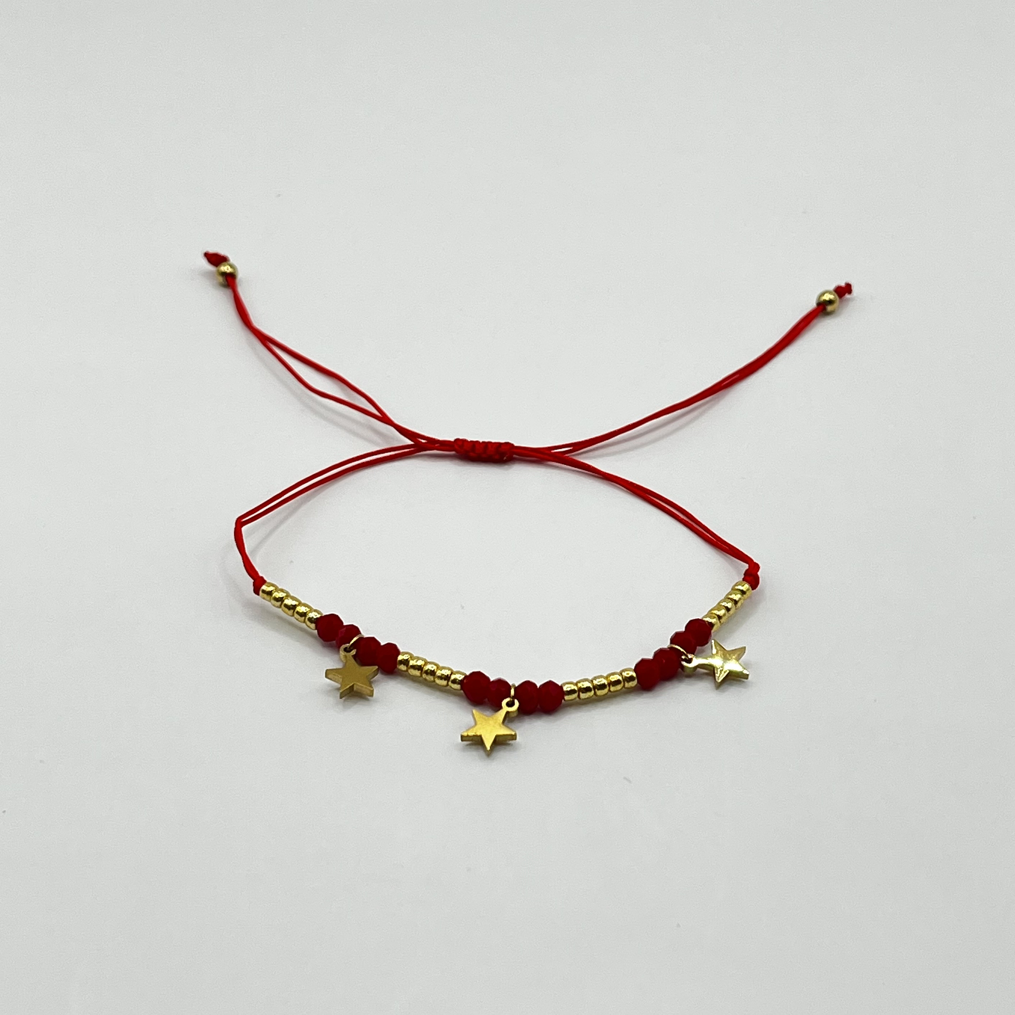 Pulsera de acero quirúrgico roja con estrellas doradas ajustable 1
