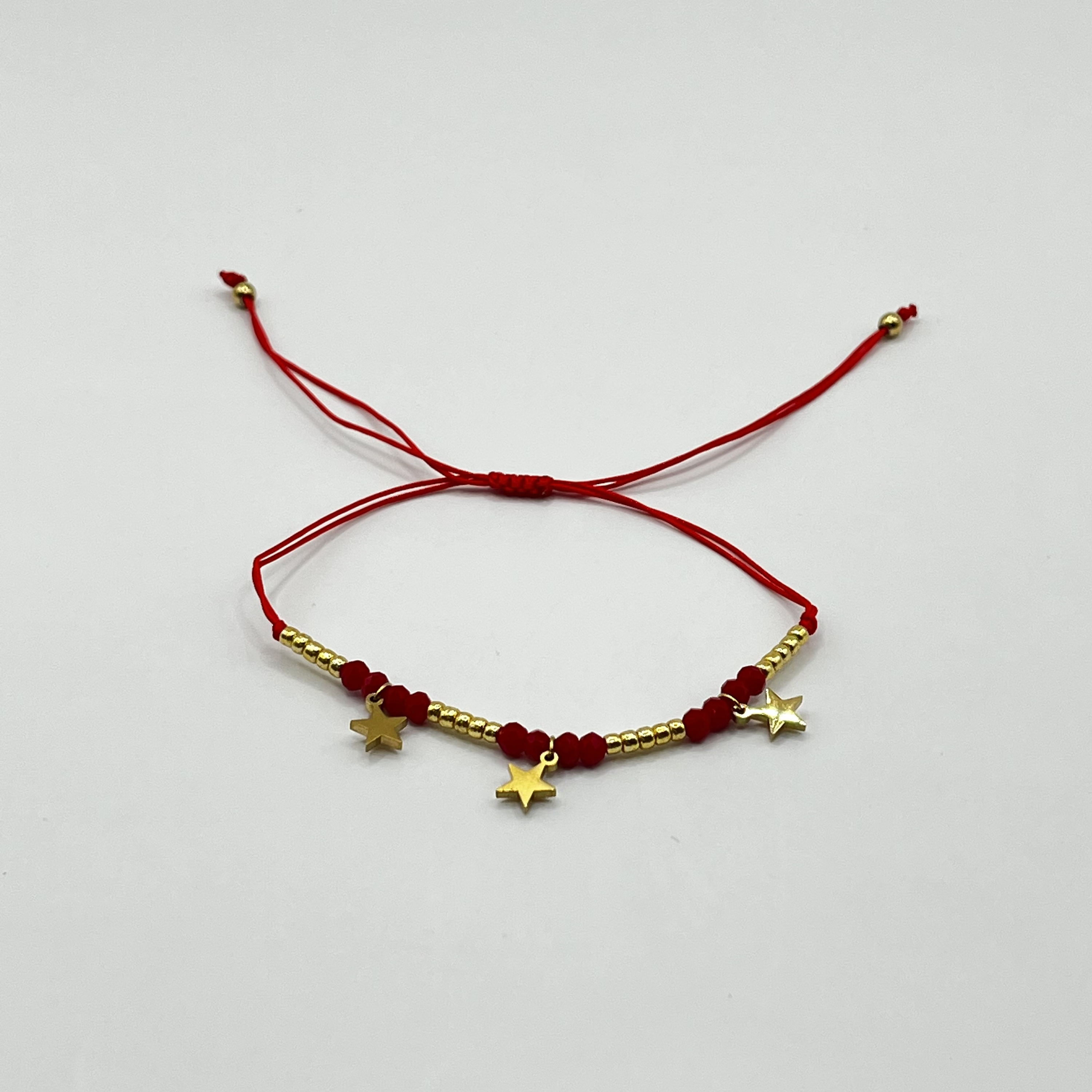 Pulsera de acero quirúrgico roja con estrellas doradas ajustable 1