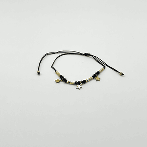 Pulsera de acero quirúrgico negra con estrellas doradas ajustable