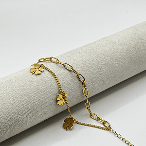 Pulsera de acero quirúrgico dorada doble cadena con tréboles