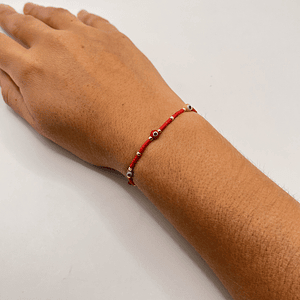 Pulsera de acero quirúrgico roja con ojitos ajustable