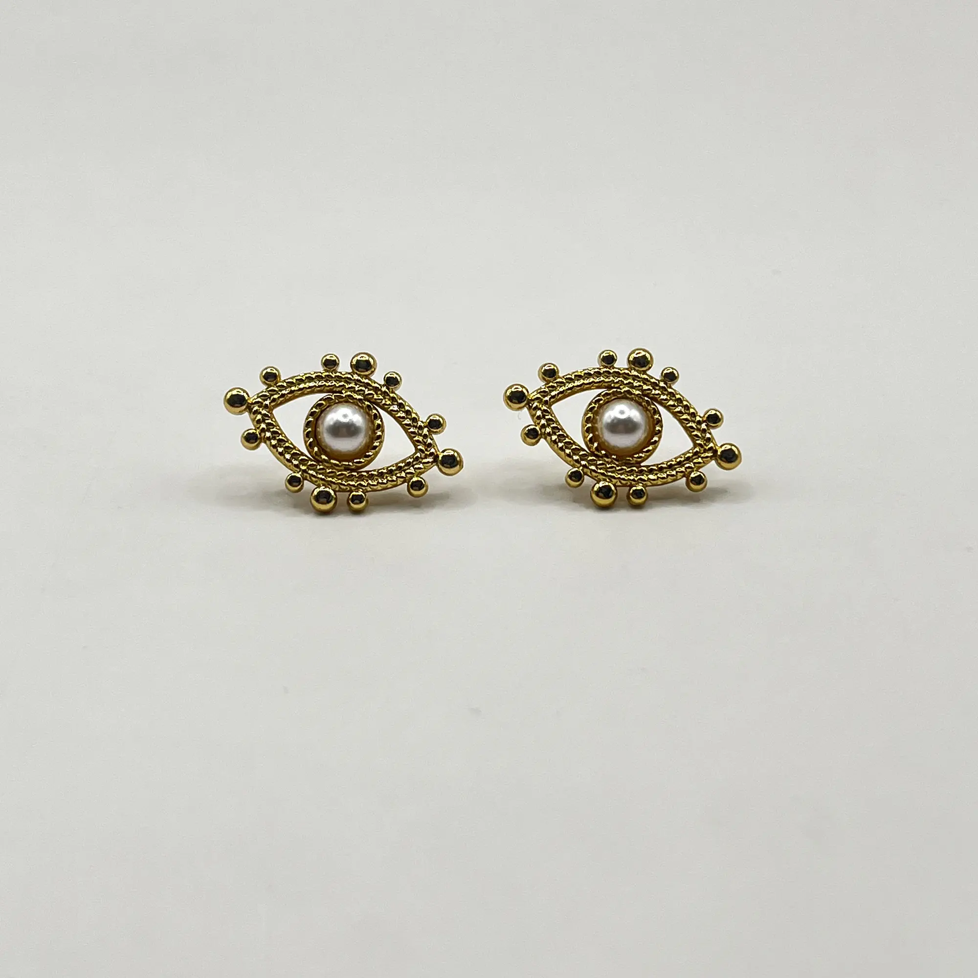 Aros de acero quirúrgico de ojos perla dorados 2