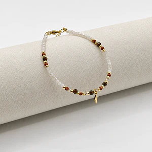 Pulsera de acero quirúrgico con cristales blancos y rayo dorado