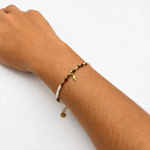 Pulsera de acero quirúrgico con cristales blancos y rayo dorado