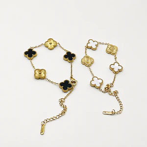 Pulsera de acero quirúrgico y nácar con flores negras y doradas