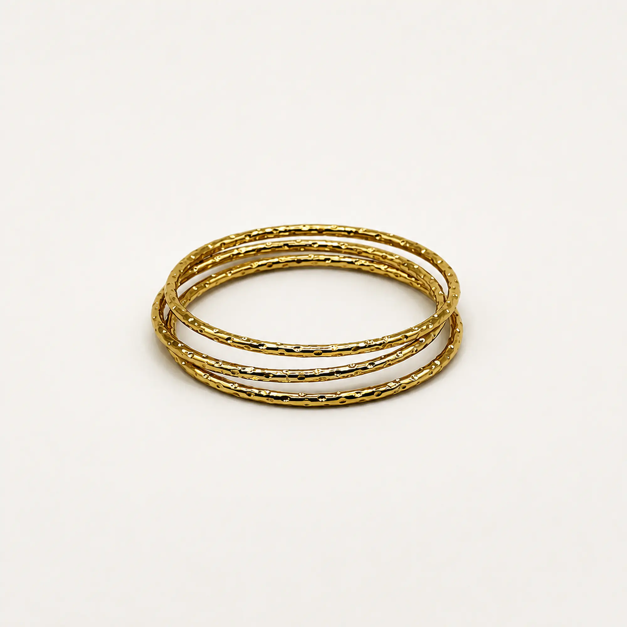 Set de 3 pulseras esclava de acero quirúrgico doradas texturadas 2