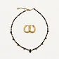 Conjunto de acero quirúrgico con choker de cristales negros y argollas doradas - Miniatura 1