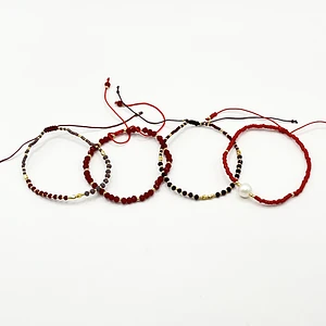 Set de 4 pulseras de acero quirúrgico con hilo ajustable y cristales