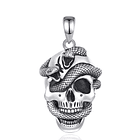 Colgante calavera con serpiente en plata fina 950 1