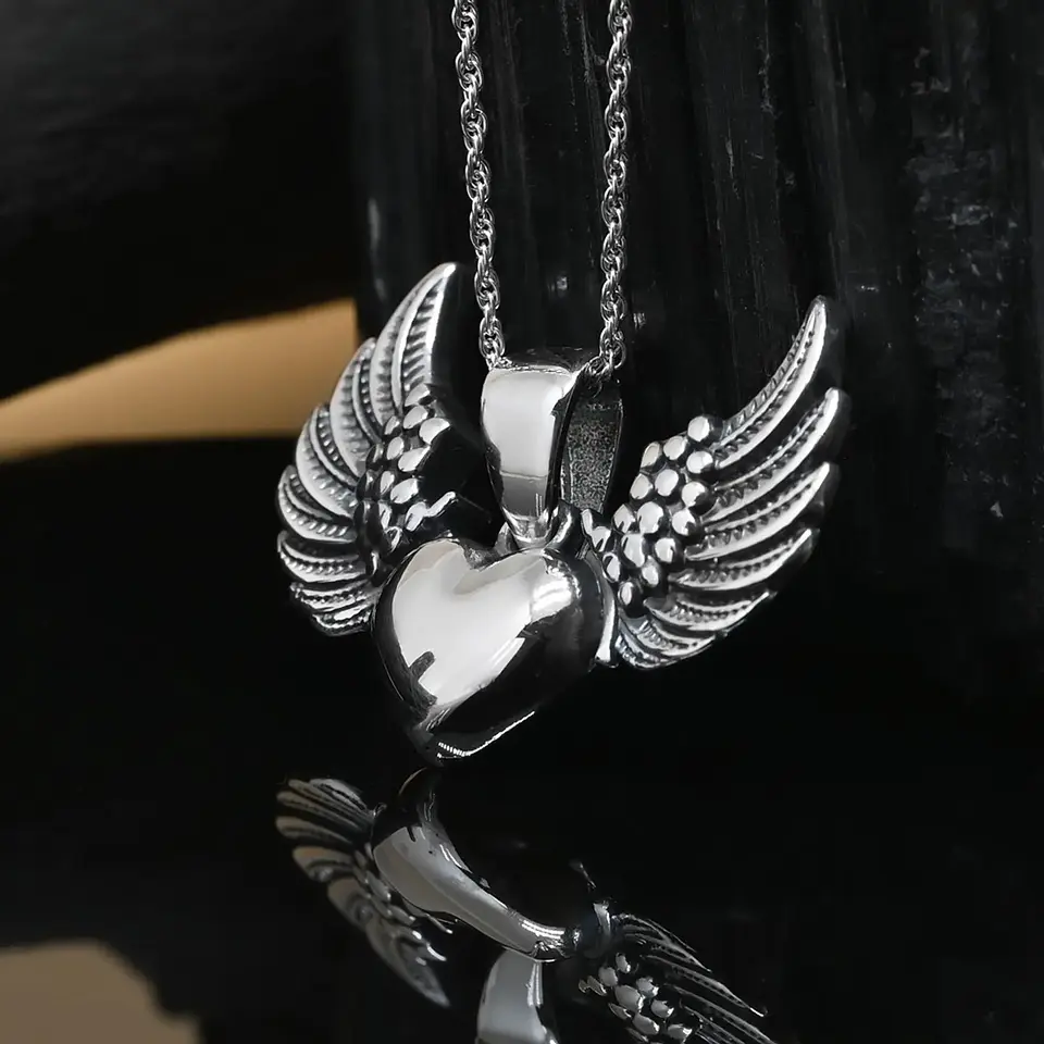 Colgante detente corazon con alas en plata 950 1