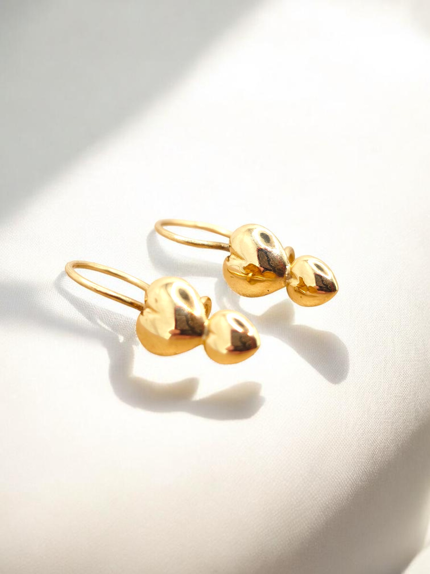 Aros dos corazones gancho Oro 18k 1