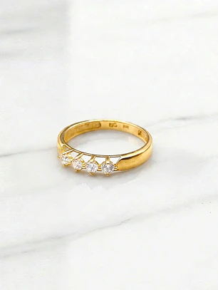 Anillo medio cintillo grifa con circones Oro 18k