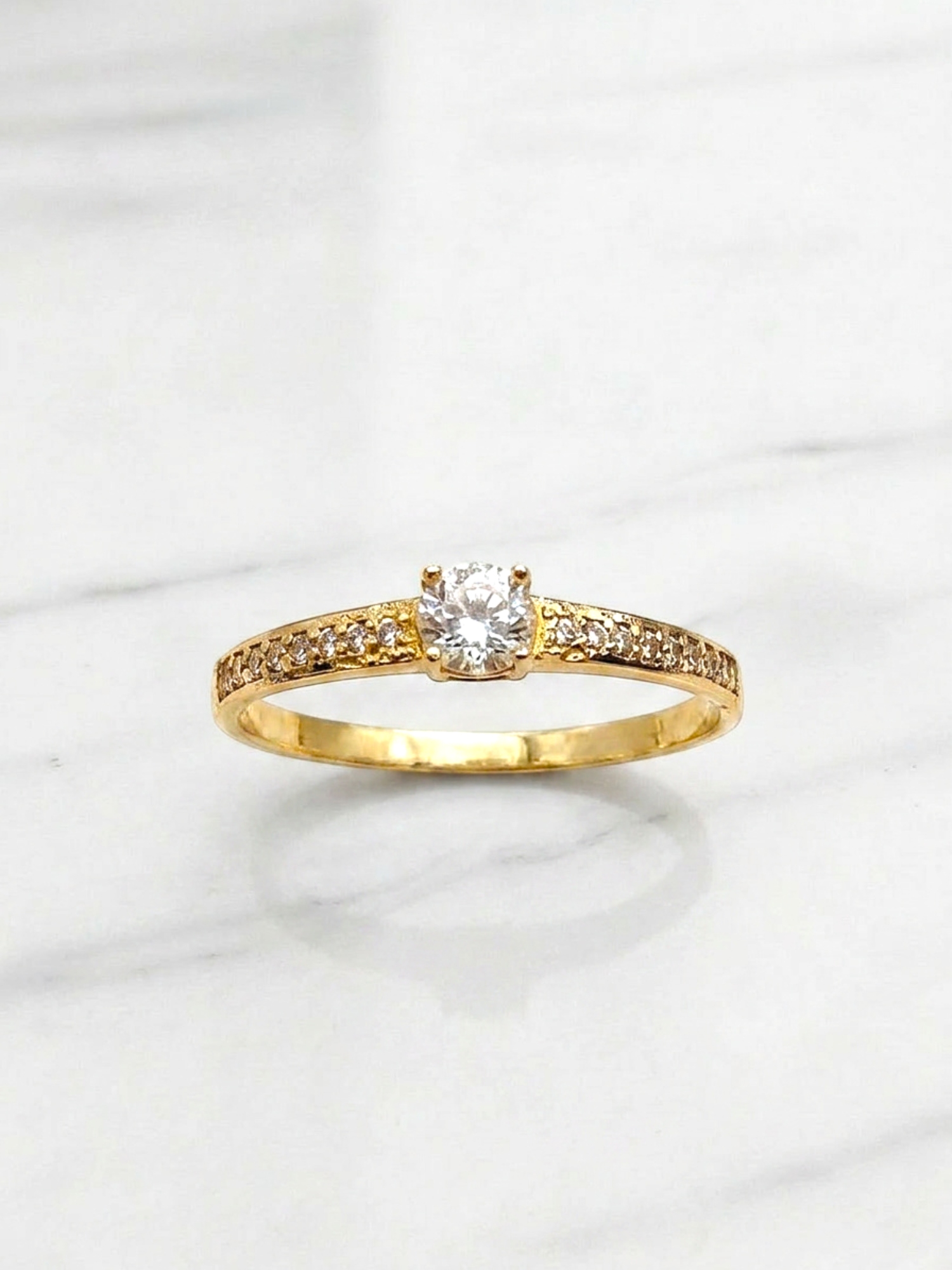 Anillo solitario cintillo circónes Oro 18k 2