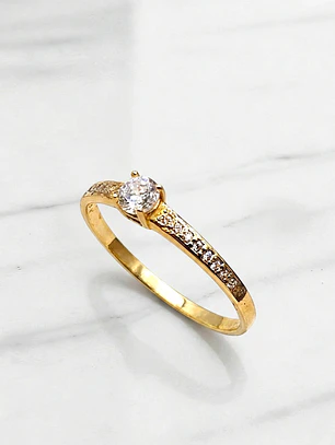 Anillo solitario cintillo circónes Oro 18k