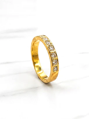 Anillo medio cintillo engastado circones Oro 18k